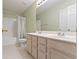 Bathroom with double vanity, neutral tile, and shower-tub combination at 11036 Ravenna Way, Indianapolis, IN 46236