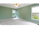 Inviting bedroom with two windows offering natural light and green walls at 11036 Ravenna Way, Indianapolis, IN 46236