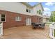 Spacious wooden deck with outdoor metal furniture and seating with a brick and white exterior at 11036 Ravenna Way, Indianapolis, IN 46236