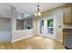 A kitchen dining area has French doors that open onto a patio area with seating at 11036 Ravenna Way, Indianapolis, IN 46236