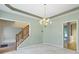 The dining room features a chandelier, and doorways that lead into other rooms of the house at 11036 Ravenna Way, Indianapolis, IN 46236
