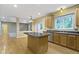 This kitchen has a center island, stainless steel appliances and hardwood floors at 11036 Ravenna Way, Indianapolis, IN 46236