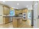 This spacious kitchen has wooden cabinets, an island and stainless steel appliances at 11036 Ravenna Way, Indianapolis, IN 46236