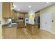 This kitchen has stainless steel appliances, a center island and wooden cabinets at 11036 Ravenna Way, Indianapolis, IN 46236