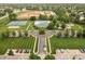 Aerial view of neighborhood amenities featuring a pool, tennis courts, playground, and parking at 1237 Wolcott Ct, Westfield, IN 46074