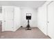 Basement exercise room with carpet, workout equipment, white walls, and white door at 1237 Wolcott Ct, Westfield, IN 46074