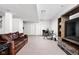 The finished basement offers a lounge area with TV, a sofa, and a high-top table at 1237 Wolcott Ct, Westfield, IN 46074
