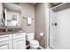 Cozy bathroom with white cabinets, a granite countertop, a shower and a toilet at 1237 Wolcott Ct, Westfield, IN 46074