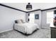 This is a simple bedroom decorated with neutral colors and two windows at 1237 Wolcott Ct, Westfield, IN 46074