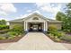 Attractive clubhouse featuring a concrete block exterior, manicured landscaping, and gated entry for community residents and their guests at 1237 Wolcott Ct, Westfield, IN 46074