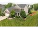 Beautiful two-story home with a well-manicured lawn and mature trees providing curb appeal at 1237 Wolcott Ct, Westfield, IN 46074