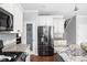 Kitchen with stainless steel appliances, granite counters and a center island with seating at 1237 Wolcott Ct, Westfield, IN 46074