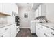 Laundry room features tile floors, built-in cabinets, a utility sink, and a washer and dryer at 1237 Wolcott Ct, Westfield, IN 46074