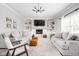 Spacious living room with built-in shelves, a fireplace, plush seating, and carpet flooring at 1237 Wolcott Ct, Westfield, IN 46074