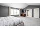 Spacious main bedroom features carpet floors, a large window, and access to the ensuite bathroom at 1237 Wolcott Ct, Westfield, IN 46074