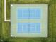 Overhead view of meticulously maintained community tennis courts with surrounding greenery at 1237 Wolcott Ct, Westfield, IN 46074