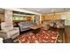 Spacious finished basement with a stylish rug, bar and stone-look pillars at 12380 Creekwood Ln, Carmel, IN 46032