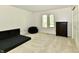 Bright bedroom with neutral carpet, ample natural light, and closet at 12380 Creekwood Ln, Carmel, IN 46032