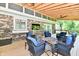 Inviting outdoor space features brickwork, comfortable seating, and a modern fire pit at 12380 Creekwood Ln, Carmel, IN 46032