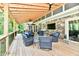 Spacious deck with comfortable seating around a modern fire pit, an outdoor TV, and natural views at 12380 Creekwood Ln, Carmel, IN 46032