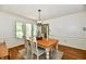 Bright dining room with a chandelier and large windows at 12380 Creekwood Ln, Carmel, IN 46032