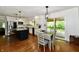 Open kitchen has a center island, stainless appliances, and sliding doors to the patio at 12380 Creekwood Ln, Carmel, IN 46032