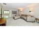Spacious living room with a sectional sofa and view of the adjoining bathroom at 12380 Creekwood Ln, Carmel, IN 46032