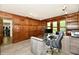 Well-lit office features wood paneled walls, concrete and glass desk, and storage solutions at 12380 Creekwood Ln, Carmel, IN 46032