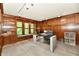 Spacious office featuring built-in shelving, tiled flooring, and natural lighting at 12380 Creekwood Ln, Carmel, IN 46032