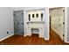 Office space showcasing a built-in desk, storage cabinets, and a striking barn door detail at 12380 Creekwood Ln, Carmel, IN 46032