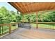 Covered porch with swing offers a peaceful outdoor space with great views at 12380 Creekwood Ln, Carmel, IN 46032