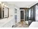 Bright bathroom features a shower, soaking tub, double vanity with white cabinets, and modern fixtures at 1264 Black Oak Dr, Greenwood, IN 46143