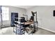 Bedroom view features a black desk workstation, bookshelves, neutral walls, and carpet at 1264 Black Oak Dr, Greenwood, IN 46143