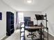 Bedroom view features a black desk workstation, bookshelves, neutral walls, and carpet at 1264 Black Oak Dr, Greenwood, IN 46143
