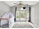 This light-filled Bedroom offers a large window and closet, and is perfect for a growing Gathering at 1264 Black Oak Dr, Greenwood, IN 46143