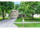 Inviting two-story house with blue shutters, well-kept lawn, and driveway leading to an attached two-car garage at 1264 Black Oak Dr, Greenwood, IN 46143