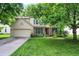 Charming two-story home with a well-manicured lawn and attached two-car garage in a quiet neighborhood at 1264 Black Oak Dr, Greenwood, IN 46143