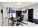 Bright, spacious game room with an advanced streaming setup and adjacent shelving, perfect for content creation or gaming enthusiasts at 1264 Black Oak Dr, Greenwood, IN 46143