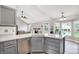 Open concept kitchen and living area with hardwood floors, stainless steel appliances and white countertops at 1264 Black Oak Dr, Greenwood, IN 46143