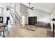 Spacious living area with vaulted ceilings and natural light, connected to the stairs and kitchen at 1264 Black Oak Dr, Greenwood, IN 46143