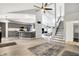 Open floor plan with hardwood floors, grey cabinets, stairs and modern lighting throughout the house at 1264 Black Oak Dr, Greenwood, IN 46143