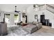 Open living area with high ceilings, a ceiling fan, and a large sofa, perfect for relaxation and entertainment at 1264 Black Oak Dr, Greenwood, IN 46143