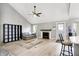 Open concept living room with a fireplace and light wood flooring, creating an inviting atmosphere at 1264 Black Oak Dr, Greenwood, IN 46143