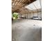 Vast barn interior featuring an open layout with ample space for various uses and vehicles with a smooth concrete floor at 1412 10Th St, Danville, IN 46122