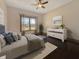 Bright bedroom with a plush bed, natural light from the window, and neutral decor at 1412 10Th St, Danville, IN 46122