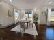 Elegant dining room with a large table, stylish chairs, a modern chandelier, and hardwood floors at 1412 10Th St, Danville, IN 46122