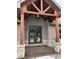 Inviting front entrance featuring a covered porch with decorative wood columns and a stylish double-door entryway at 1412 10Th St, Danville, IN 46122