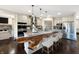 Modern kitchen with stainless steel appliances, a large island featuring a unique wood countertop, and pendant lighting at 1412 10Th St, Danville, IN 46122