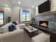 Comfortable living room with fireplace, large window, plush seating, and a cozy atmosphere at 1412 10Th St, Danville, IN 46122