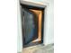 A view of the safe room door, complete with a secure locking mechanism, offering peace of mind and security at 1412 10Th St, Danville, IN 46122